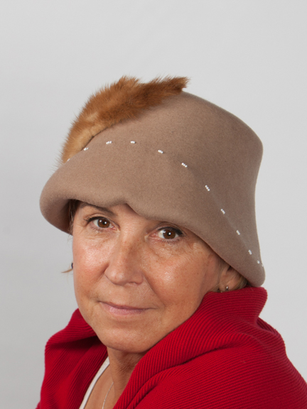 Front view of a mink wool felt hat with to the sidemink tail detail