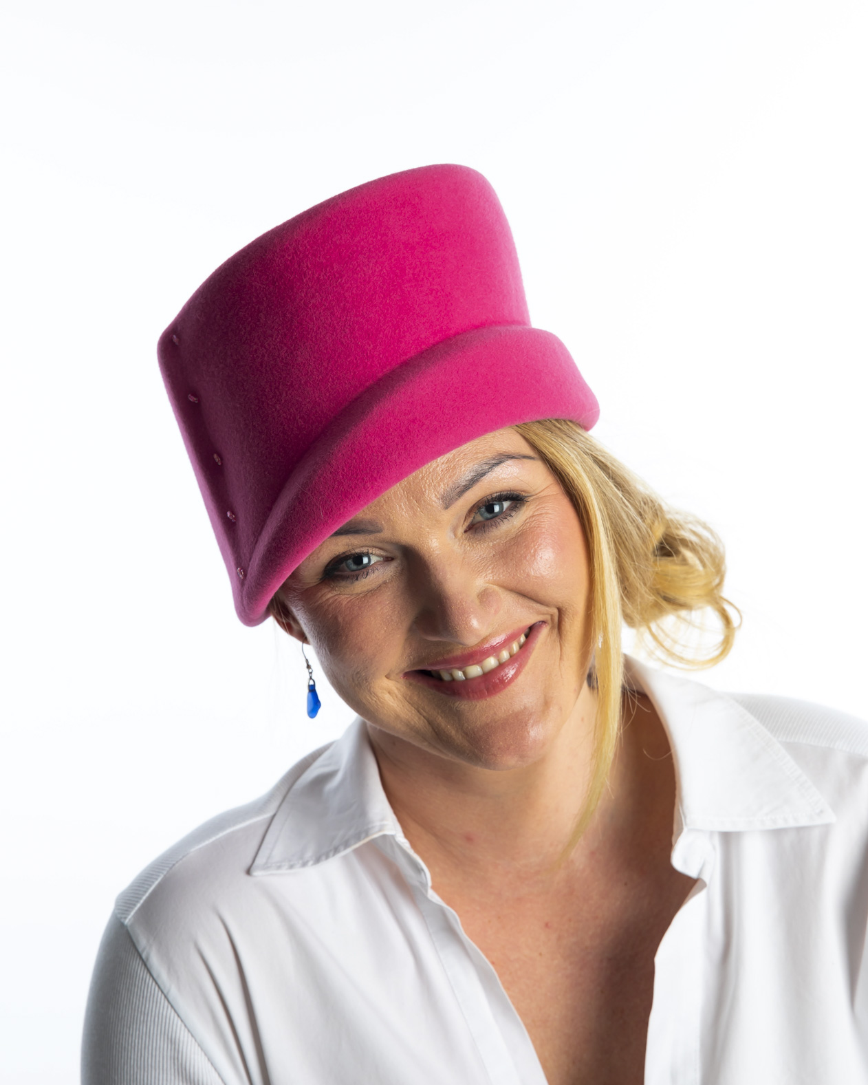 Side view of pink wool felt hat with same colour felt detail